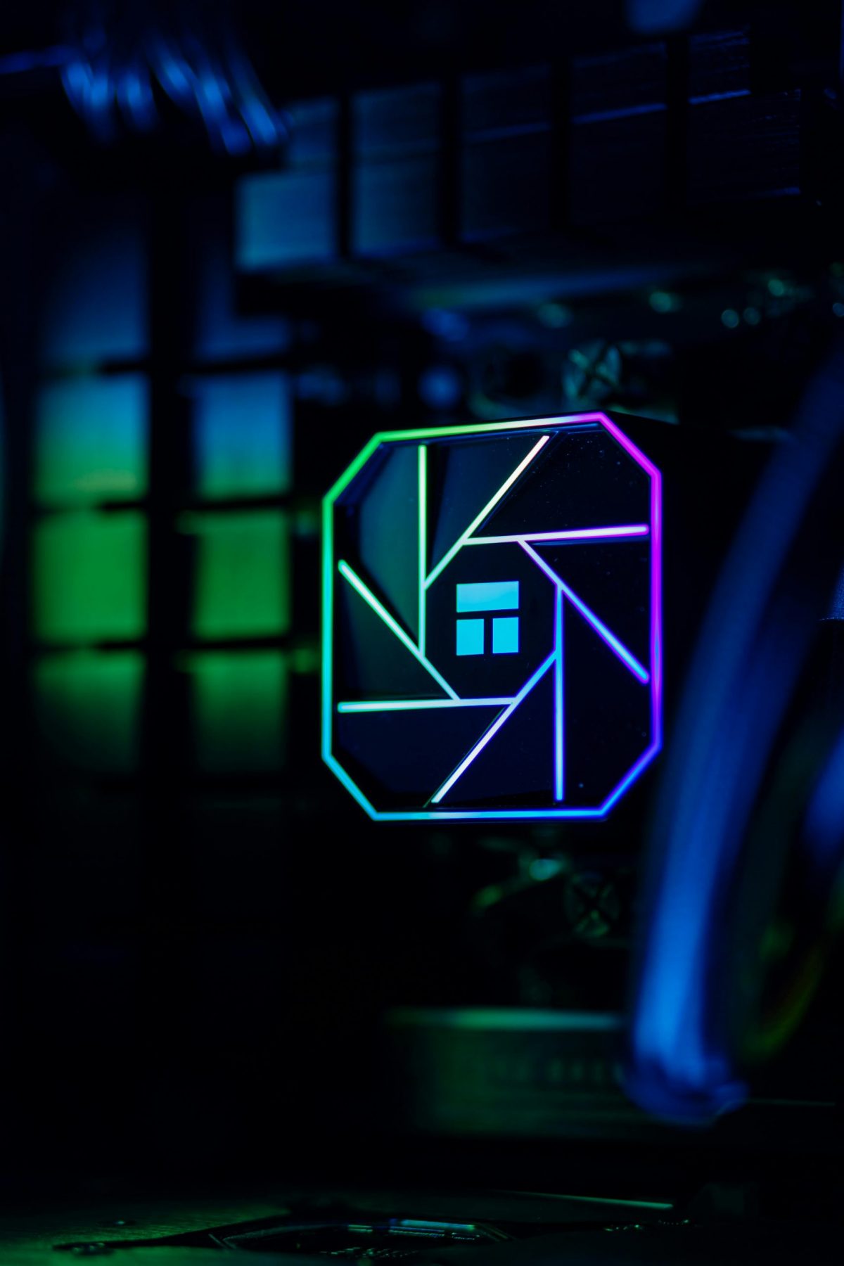Close-up of colorful RGB lighting in a custom-built PC showcasing advanced cooling technology.